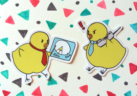 Two stickers are on a background with a geometric pattern. The stickers are two fat chicks, wearing ties. The one on the left is using a stick to point to a chart of an egg. The chick on the right is holding an old, 80's style cell phone and has an exclamation mark above it's head. 